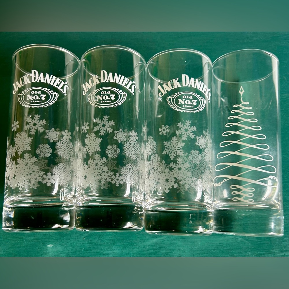 4 Jack Daniels Holiday 3 w/snowflakes & 1 w/a tree. Highballs. 6”H